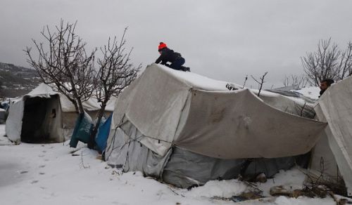 Women and Children in Jordan&#039;s Syrian Refugee Camp having been Abandoned by the Jordanian Government, Battle for Survival under Severe Weather Conditions